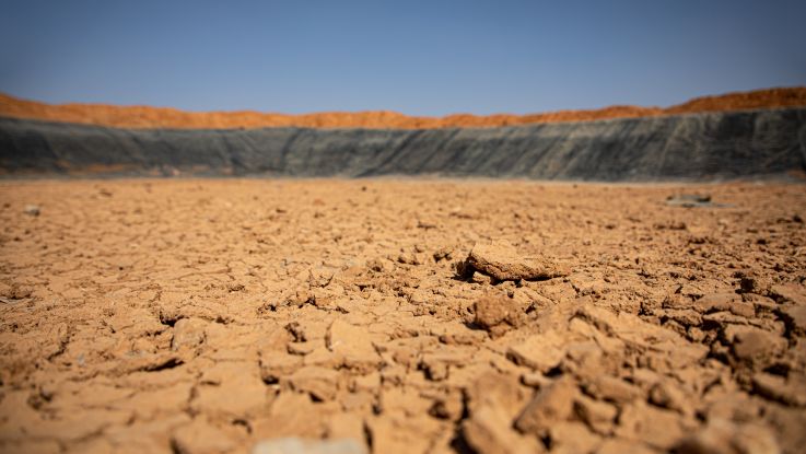 Once filled with over 150,000 barrels of water, this ActionAid implemented earth dam is now completely dry due to failed rains and increasing temperatures.